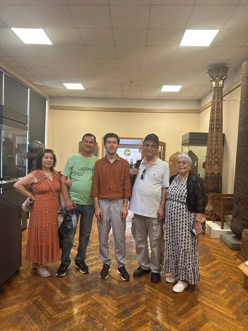 Our guide with a family of guests at a museum